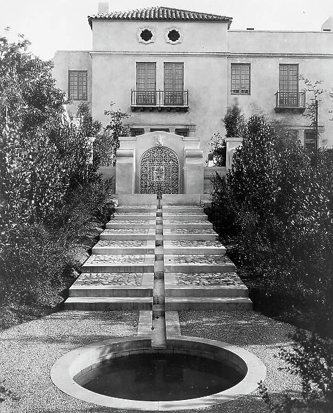 Pasadena, California, Mrs. Herbert Coppell home - pond at foot of long stairway leading... 1917. Creator: Frances Benjamin Johnston