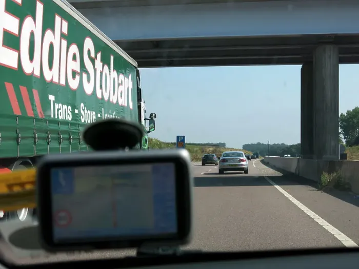 Framed Print : Passing Eddie Stobart truck on the A46 with satnav screen on windscreen Framed Print : Passing Eddie Stobart truck on the A46 with satnav screen on windscreen