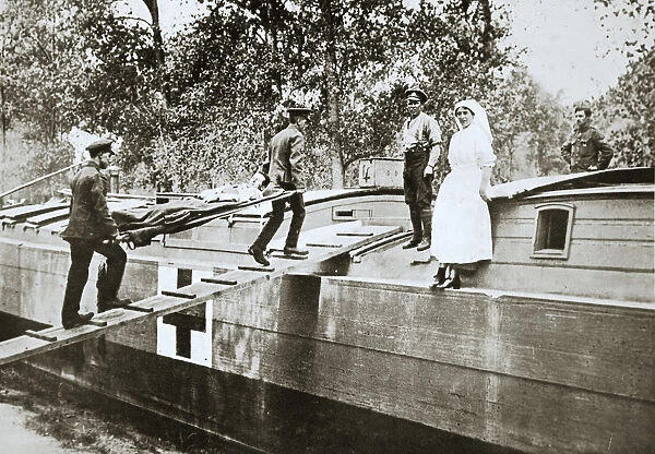 Patients being taken on board a hospital barge, Somme campaign, France, World War I, 1916