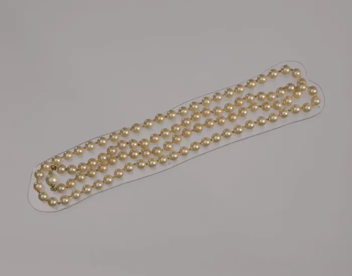 Framed Print : Pearl necklace from Maes Millinery Shop, 1941-1994. Creator: Unknown