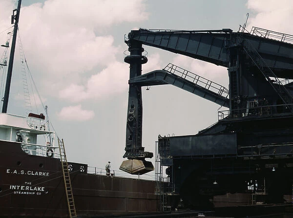 Pennsylvania R.R. ore docks, unloading ore from a lake freighter by means... Cleveland, Ohio, 1943. Creator: Jack Delano