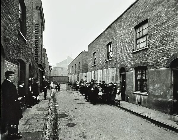 People outside boarded-up houses in Ainstey Street, Bermondsey, London, 1903