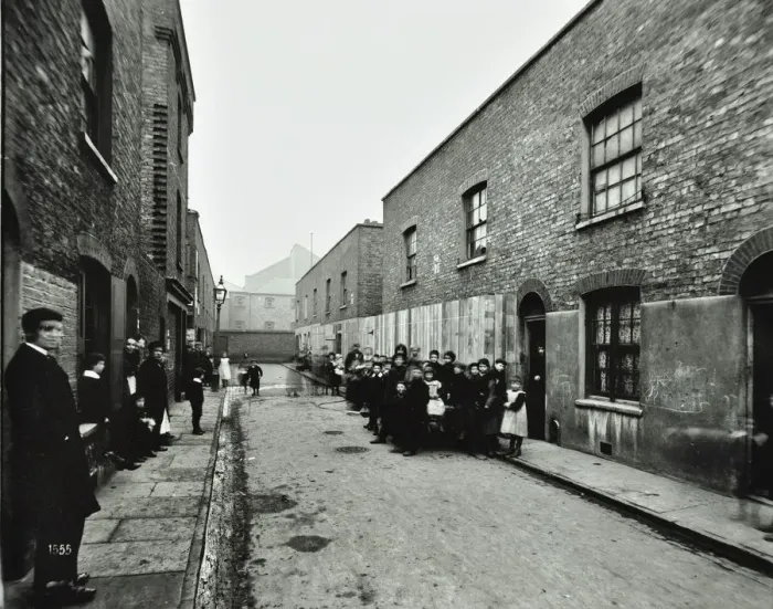 Framed Print : People outside boarded-up houses in Ainstey Street, Bermondsey, London, 1903 Framed Print : People outside boarded-up houses in Ainstey Street, Bermondsey, London, 1903