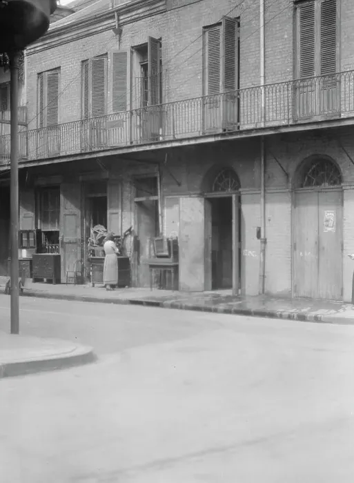Framed Print : People standing by the doorway of a furniture shop in the French Quarter, New Orleans, c1920-1926. Creator: Arnold Genthe Framed Print : People standing by the doorway of a furniture shop in the French Quarter, New Orleans, c1920-1926. Creator: Arnold Genthe