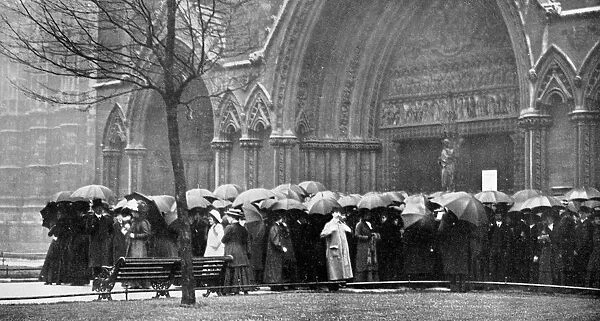 People waiting in the rain in order to attend a service at Westminster Abbey, London, 1910
