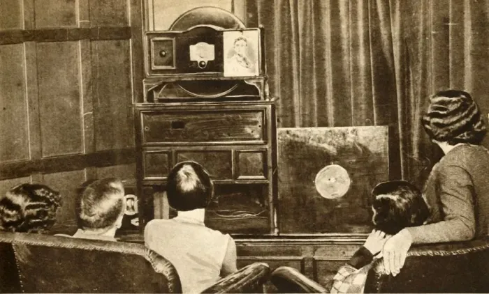 Framed Print : People watching an early television broadcast, c1930, (1933). Creator: Unknown Framed Print : People watching an early television broadcast, c1930, (1933). Creator: Unknown