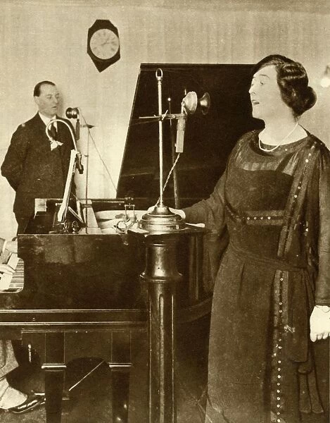 Performers singing a duet in one of the studios of 2LO, Savoy Hill, London, 1923, (1935)