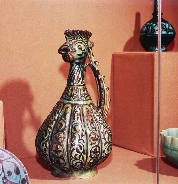 Persian (Kashan) Ewer with cockerels head and tail handle, early 13th century