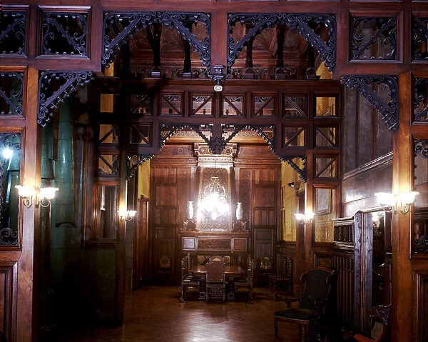 Perspective view of the main dining room of the Güell Palace with the original furniture