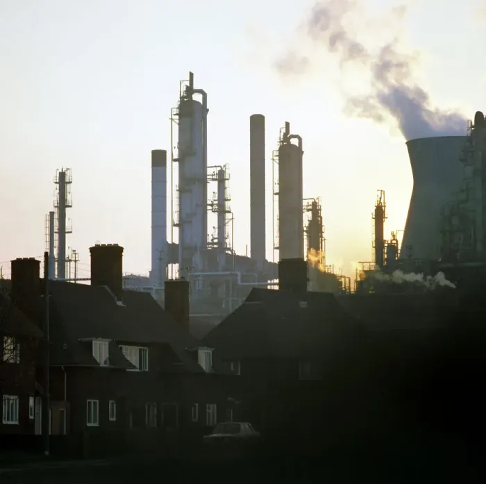 Framed Print : A petrochemical plant towering over residential housing, Baglan Bay, Wales, 1975 Framed Print : A petrochemical plant towering over residential housing, Baglan Bay, Wales, 1975