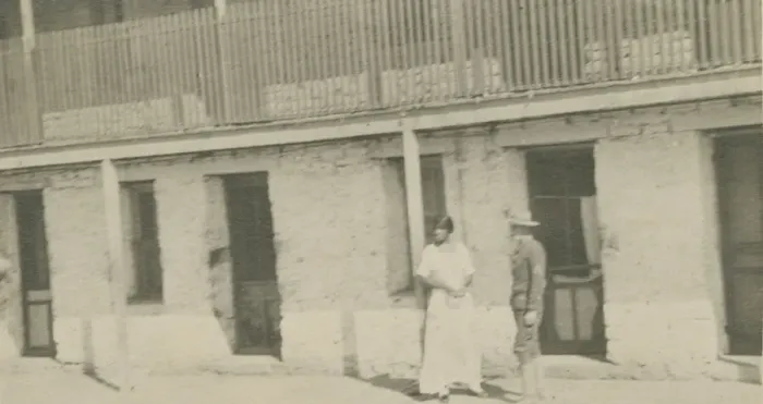 Framed Print : Photograph of a man and woman standing on a sidewalk, early 20th century Framed Print : Photograph of a man and woman standing on a sidewalk, early 20th century