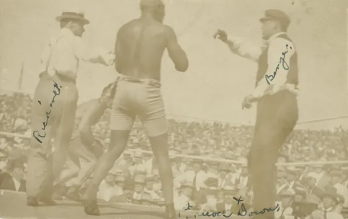 Framed Print : Photographic postcard of James J. Jeffries staggering away from Jack Johnson, 1910 Framed Print : Photographic postcard of James J. Jeffries staggering away from Jack Johnson, 1910