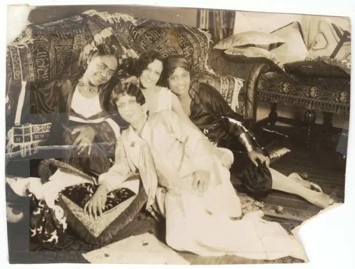 Framed Print : Photographic print of 4 women sitting in front of a sofa, early 20th century Framed Print : Photographic print of 4 women sitting in front of a sofa, early 20th century