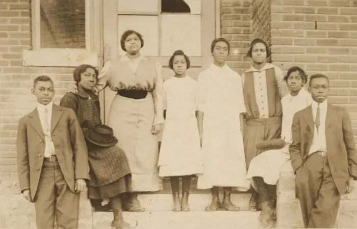 Framed Print : Photographic print of 8 people in front of a building, 1904-1918. Creator: Unknown Framed Print : Photographic print of 8 people in front of a building, 1904-1918. Creator: Unknown