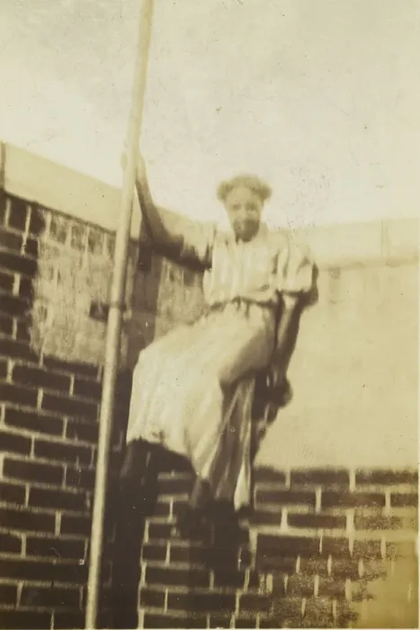 Framed Print : Photographic print of a woman on a brick wall, early 20th century. Creator: Unknown Framed Print : Photographic print of a woman on a brick wall, early 20th century. Creator: Unknown
