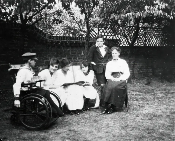 Framed Print : A physically disabled boy sitting in a wheelchair in a garden, c1910 / 1925. Creator: Unknown Framed Print : A physically disabled boy sitting in a wheelchair in a garden, c1910 / 1925. Creator: Unknown