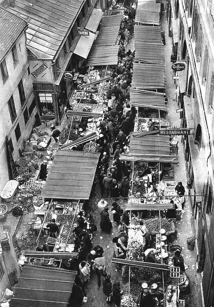 The picturesque market in Passage Berryer, Paris, 1931. Artist: Ernest Flammarion