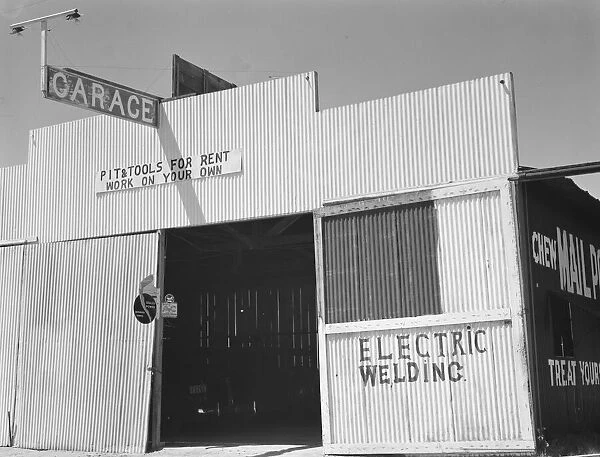 'Pit and tools for rent--work on your own', U. S. 99, Fresno County, California, 1939. Creator: Dorothea Lange