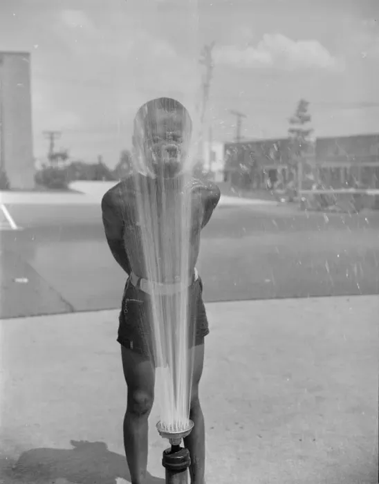 Framed Print : Playing in the community sprayer, Frederick Douglass housing project, Anacostia, D. C. 1942. Creator: Gordon Parks Framed Print : Playing in the community sprayer, Frederick Douglass housing project, Anacostia, D. C. 1942. Creator: Gordon Parks