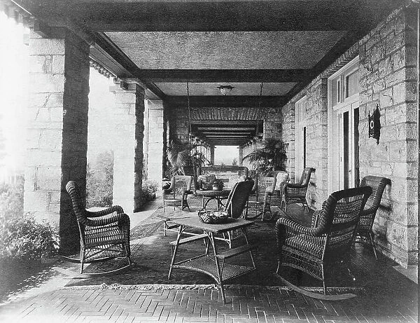 Porch of E.C. Converse house, with wicker furniture, Greenwich, Connecticut, 1908. Creator: Frances Benjamin Johnston