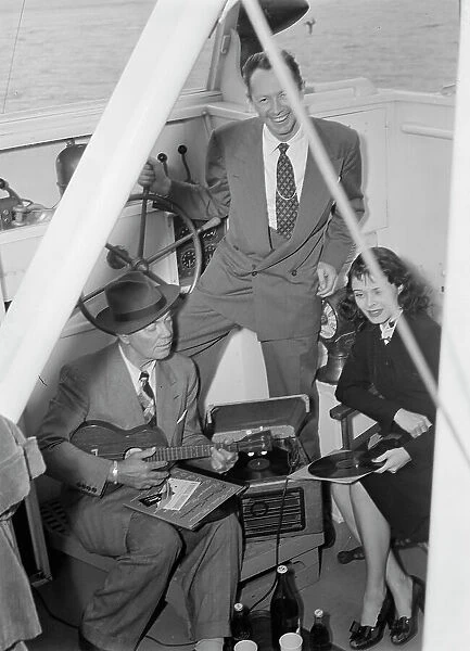 Portrait of Cliff Edwards, Betty Brewer, and Frank...Ukelele Lady (yacht), Hudson River, N.Y. 1947. Creator: William Paul Gottlieb