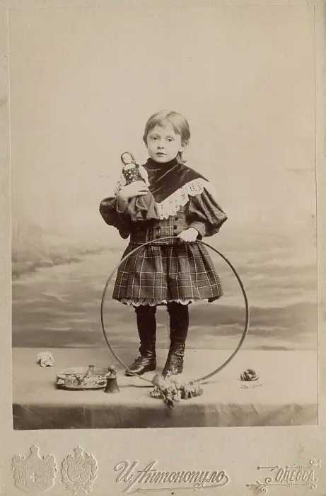 Framed Print : Portrait of a girl with a hoop and a doll, 1900. Creator: I. Antonopulo
