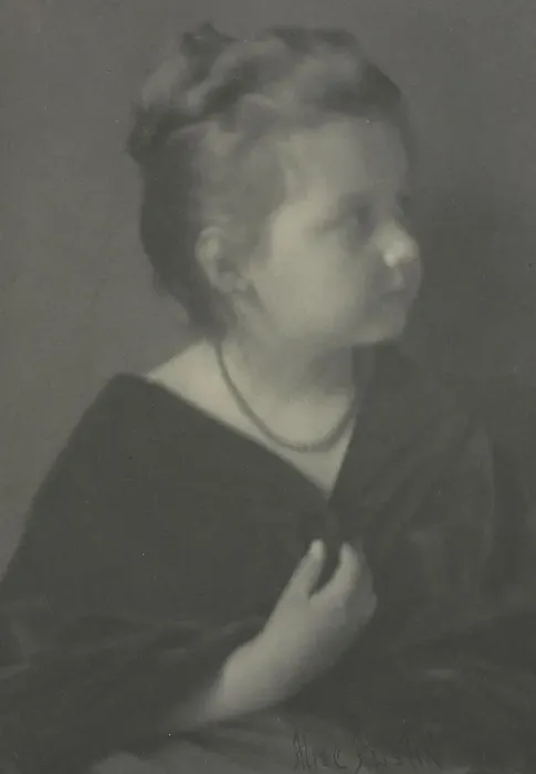 Framed Print : Portrait of a girl with a necklace clasping a shawl, c1900. Creator: Alice Austin Framed Print : Portrait of a girl with a necklace clasping a shawl, c1900. Creator: Alice Austin