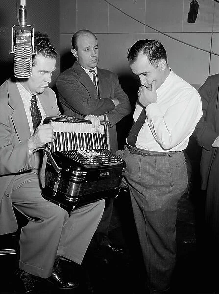 Portrait of Joe Mooney, Milt Gabler, and Morty Palitz, Decca studio, New York, N.Y. ca. Dec. 1946. Creator: William Paul Gottlieb