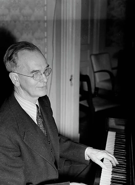Portrait of Roy J. Carew in his home, 818 Quintana Place NW, Washington, D.C. ca. Feb. 1942. Creator: William Paul Gottlieb