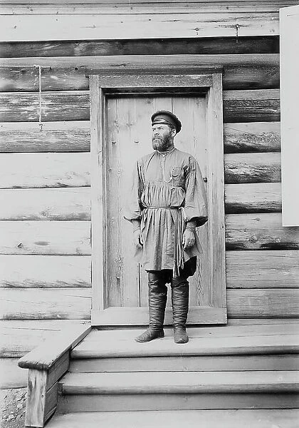 Portrait of an unknown man on the porch of a wooden house, 1900. Creators: I. A. Podgorbunskii, V. I. Podgorbunskii