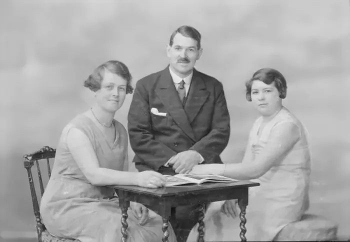 Framed Print : Portrait of two women and a man, c1935. Creator: Kirk & Sons of Cowes Framed Print : Portrait of two women and a man, c1935. Creator: Kirk & Sons of Cowes