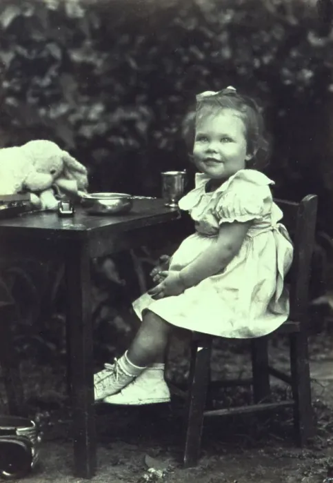 Framed Print : Portrait of a young girl seated at an outdoor table, facing front, between 1940 and 1950. Creator: Joseph Woodson Whitesell Framed Print : Portrait of a young girl seated at an outdoor table, facing front, between 1940 and 1950. Creator: Joseph Woodson Whitesell