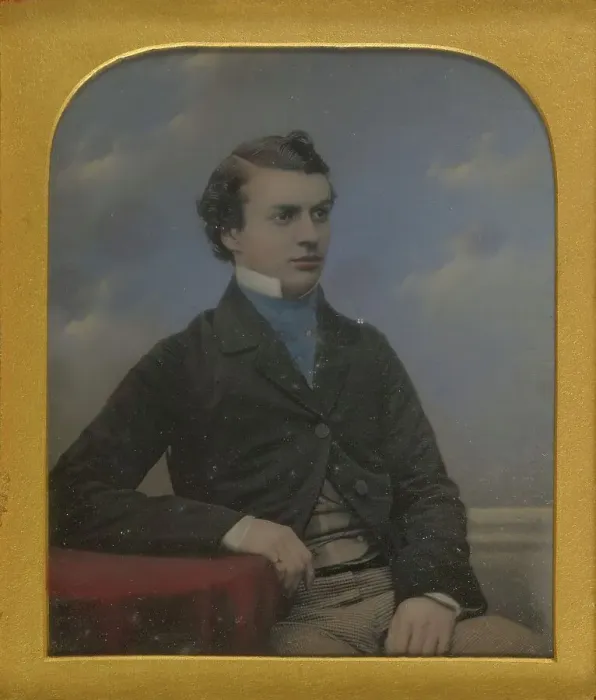 Framed Print : Portrait of a Young Man Seated at Table, about 1852. Creator: Richard Beard