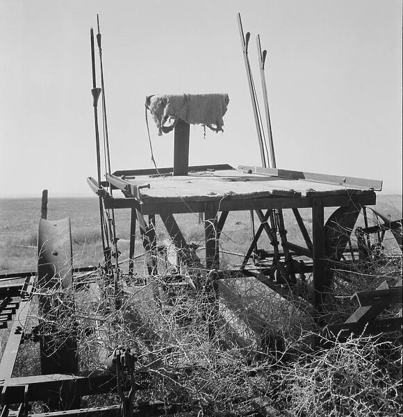Possibly: Farm machinery left on abandoned dry land farm in Columbian Basin, Washington, 1939. Creator: Dorothea Lange