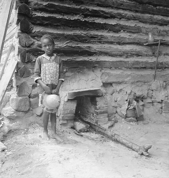Possibly: Grandchildren of tobacco sharecropper down at barns, Wake County, North Carolina, 1939. Creator: Dorothea Lange