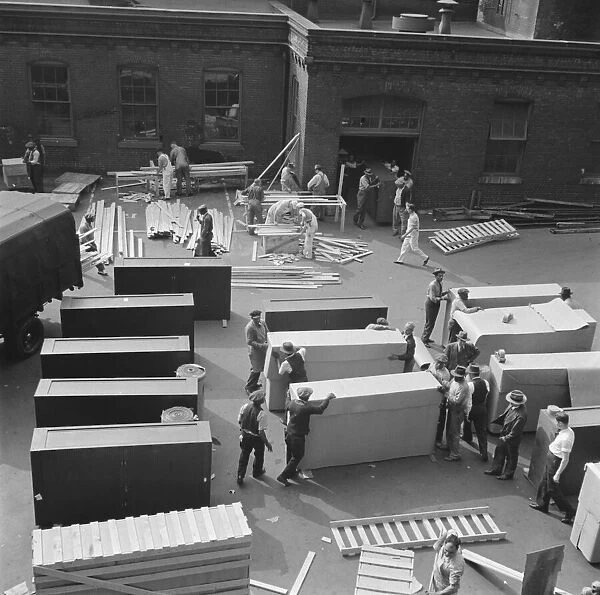 Possibly: United States government workers and carpenters making crates... Washington, D.C. 1942. Creator: Gordon Parks