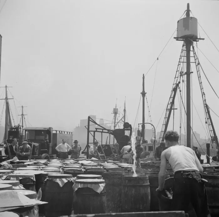 Framed Print : Possibly: Watering fish at the Fulton fish market with brine water, New York, 1943. Creator: Gordon Parks Framed Print : Possibly: Watering fish at the Fulton fish market with brine water, New York, 1943. Creator: Gordon Parks