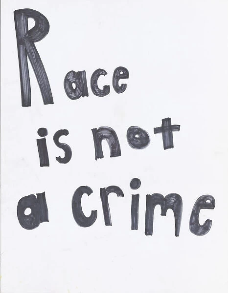 Poster reading 'Race is not a crime'used at Baltimore protests, April 2015