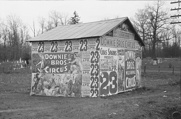 Posters covering a building near Lynchburg to advertise a Downie Bros. circus, 1936. Creator: Walker Evans