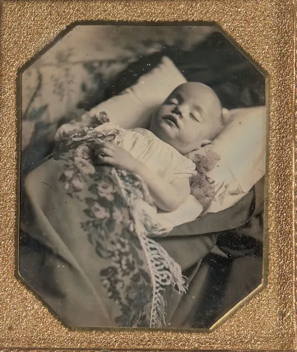 Framed Print : Postmortem Baby, Partially Covered by a Flowered Shawl with a Fringe Hem, 1840s Framed Print : Postmortem Baby, Partially Covered by a Flowered Shawl with a Fringe Hem, 1840s