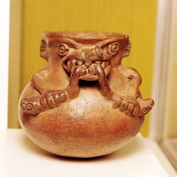 Pottery Bowl of an alligator with human arms devouring snakes, Chiriqui, Panama