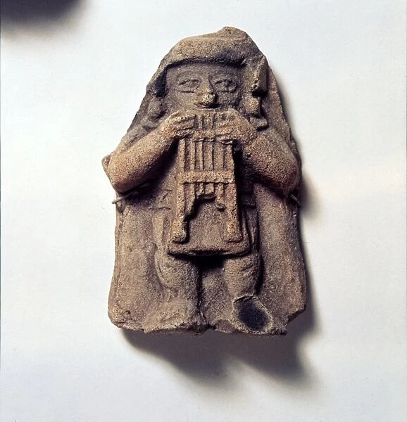 Pottery Figure of Man with Pan Pipes, from Coumbia, Pre Columbian