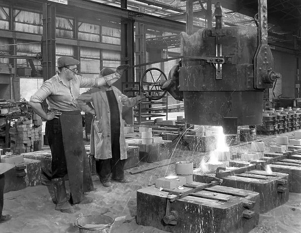 Pouring a small casting at Edgar Allens Steel foundry, Sheffield, South Yorkshire, 1963