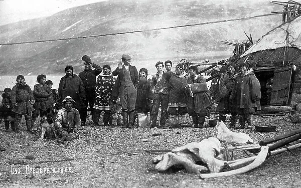 Preobrazhenie Bay: Chukchi in front of their home, in national traditional fur clothing..., 1910-29. Creator: Ivan Emelianovich Larin