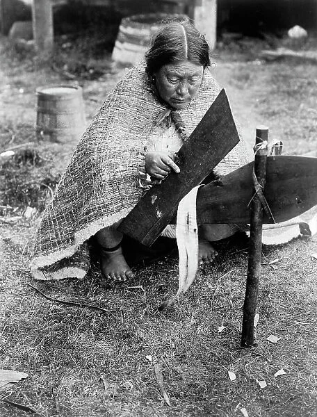 Preparing cedar bark-Nakoaktok, c1914. Creator: Edward Sheriff Curtis
