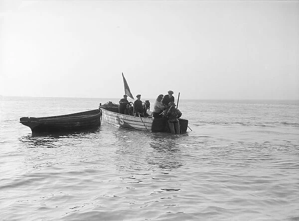 Preparing diver for sea salvage, 1912. Creator: Kirk & Sons of Cowes