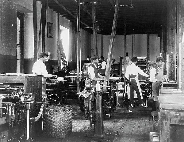Pressmen at work in printing shop, Hampton Institute, Hampton, Virginia, 1899 or1900. Creator: Frances Benjamin Johnston