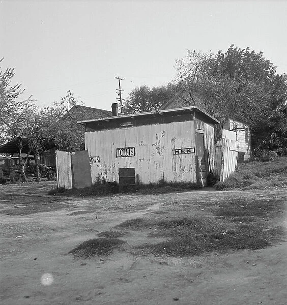 Privy in cheap migratory camp, San Joaquin Valley, California, 1936. Creator: Dorothea Lange