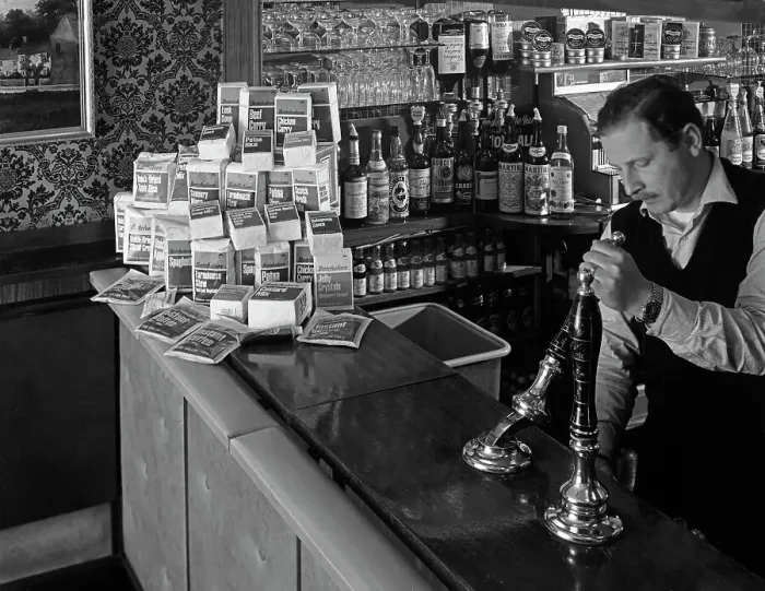 Framed Print : A pub landlord with a display of the Batchelors 5 day catering pack on his bar, 1968 Framed Print : A pub landlord with a display of the Batchelors 5 day catering pack on his bar, 1968