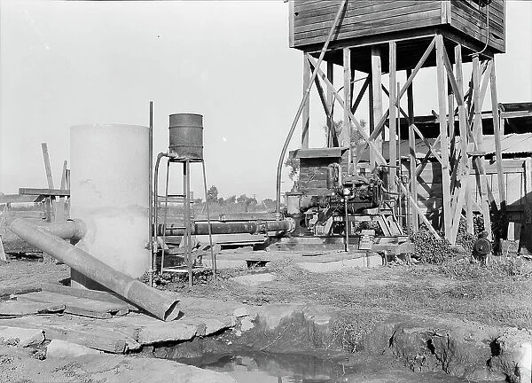 Pumping plant for irrigation powered by a natural gas engine, Tulare County, California, 1938. Creator: Dorothea Lange